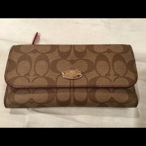 Coach emblem trifold wallet
